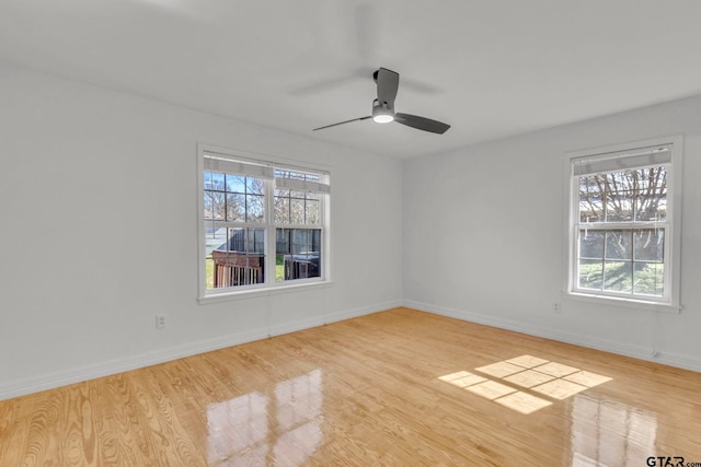 unfurnished room with ceiling fan and light hardwood / wood-style floors