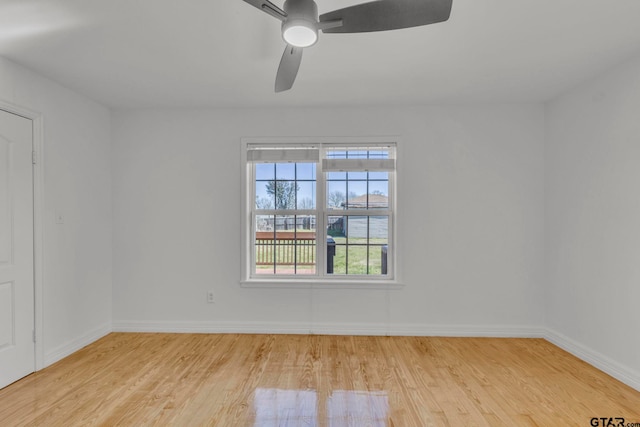 unfurnished room featuring light hardwood / wood-style flooring and ceiling fan