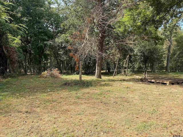 view of landscape featuring a forest view