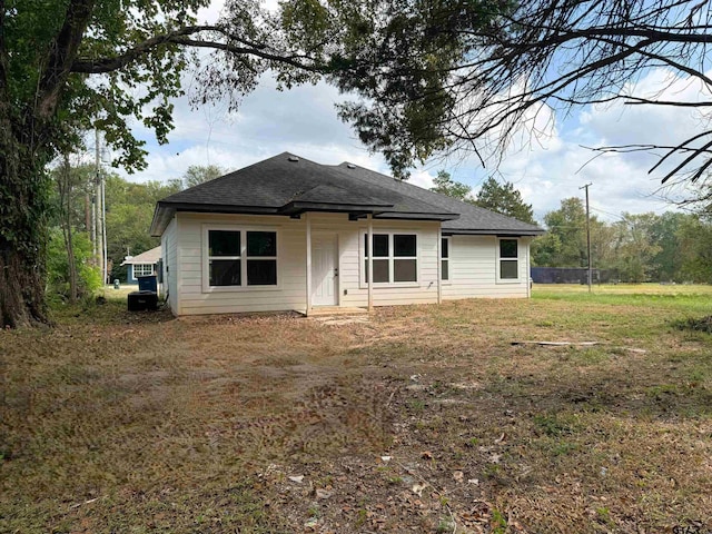 view of front of house with roof with shingles