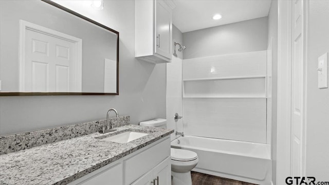 full bathroom with toilet, vanity, bathing tub / shower combination, and wood finished floors