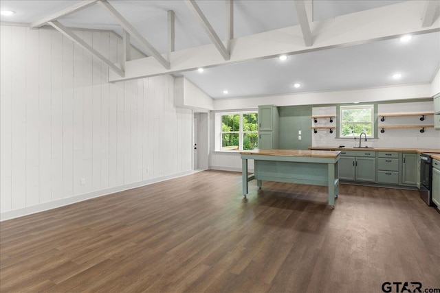 kitchen with wood counters, sink, lofted ceiling with beams, dark hardwood / wood-style flooring, and decorative backsplash