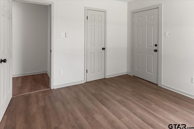 unfurnished bedroom with wood-type flooring