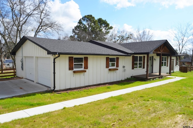 view of front of home featuring a garage and a front lawn