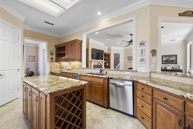 2213 Woodlands Dr, Tyler, TX 75703 - kitchen featuring dishwasher, a sink, ceiling fan, decorative backsplash, and brown cabinets