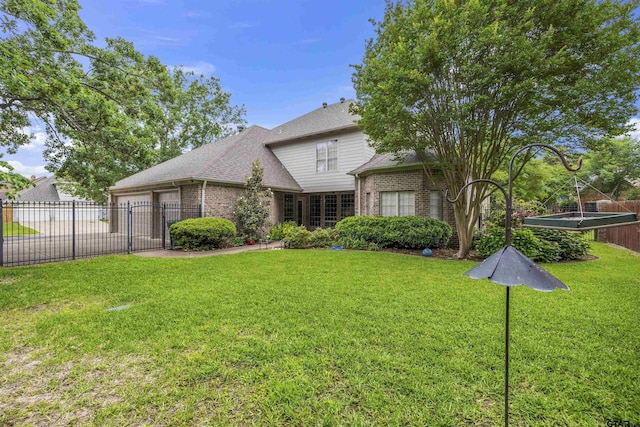 2213 Woodlands Dr, Tyler, TX 75703 - back of property with brick siding, concrete driveway, a garage, and roof with shingles