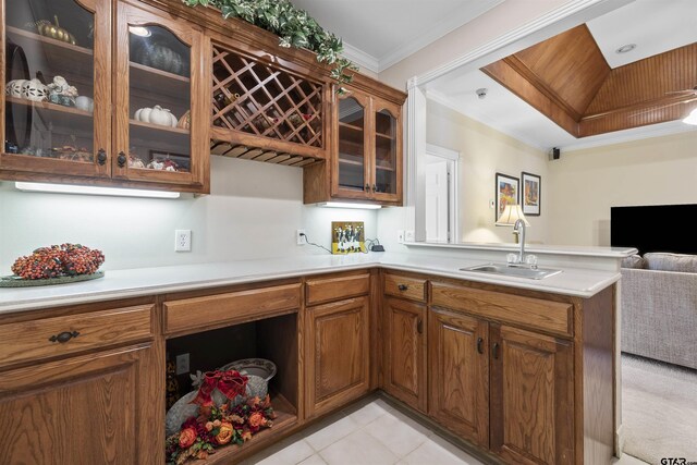 2213 Woodlands Dr, Tyler, TX 75703 - bar featuring a sink, crown molding, and light tile patterned floors