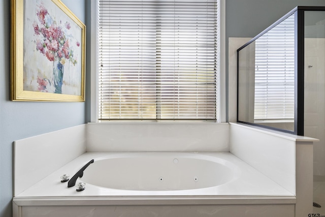 2213 Woodlands Dr, Tyler, TX 75703 - bathroom with a jetted tub