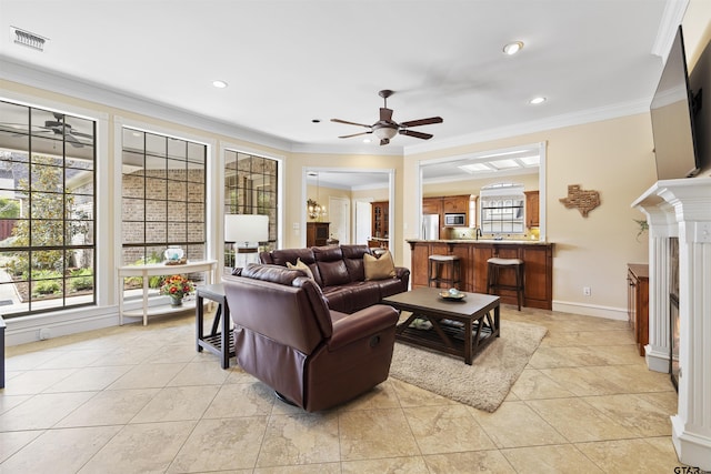 2213 Woodlands Dr, Tyler, TX 75703 - living room with a ceiling fan, a fireplace, visible vents, ornamental molding, and recessed lighting