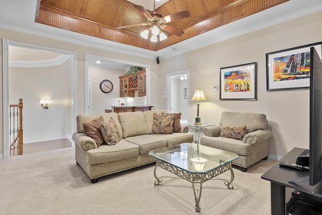 2213 Woodlands Dr, Tyler, TX 75703 - carpeted living room featuring a raised ceiling, a ceiling fan, crown molding, and wooden ceiling