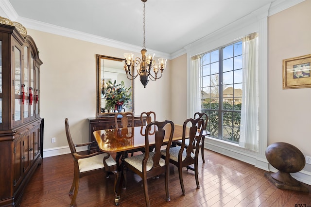 2213 Woodlands Dr, Tyler, TX 75703 - dining area featuring a notable chandelier, a healthy amount of sunlight, and dark wood-style floors