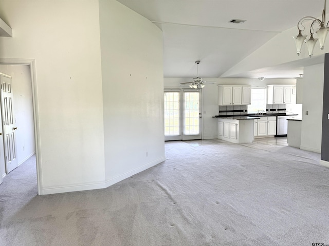 39 County Road 2933, Pittsburg, TX 75686 - unfurnished living room with light colored carpet, lofted ceiling, baseboards, and ceiling fan
