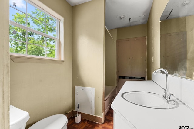 full bath with toilet and a sink