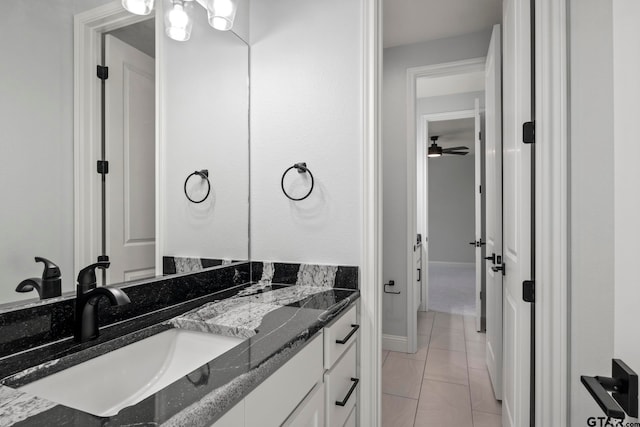 bathroom with tile patterned flooring and vanity