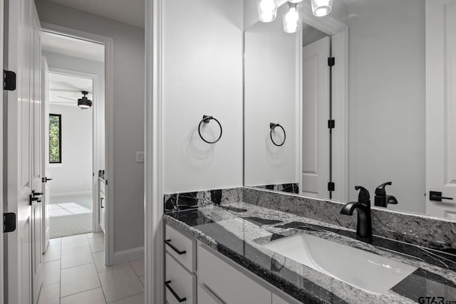 bathroom with ceiling fan, vanity, and tile patterned floors