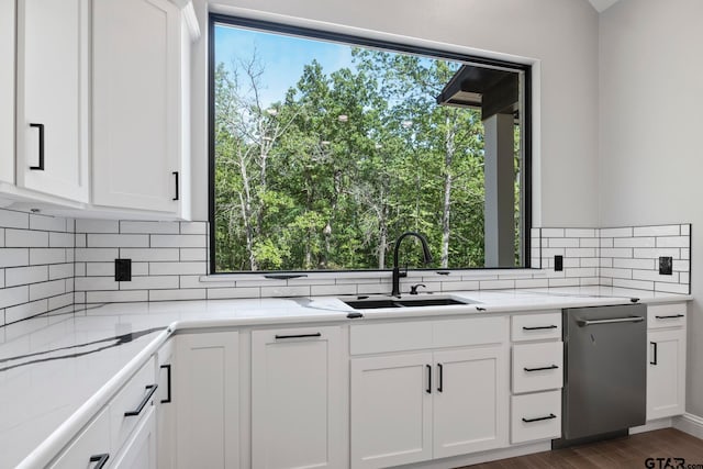 kitchen featuring white cabinetry and tasteful backsplash