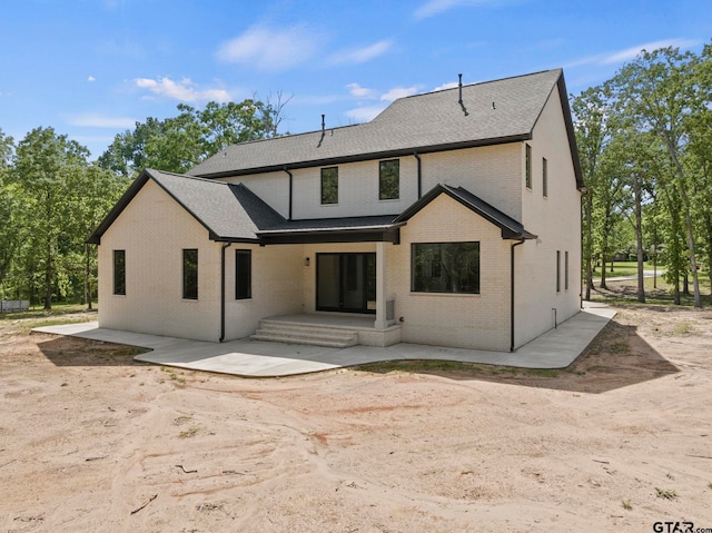 back of house with a patio area