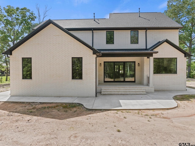 rear view of property featuring a patio area