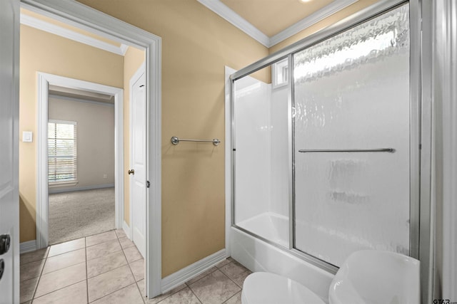 bathroom featuring toilet, tile patterned floors, shower / bath combination with glass door, and crown molding