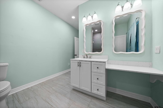 bathroom with vanity and toilet