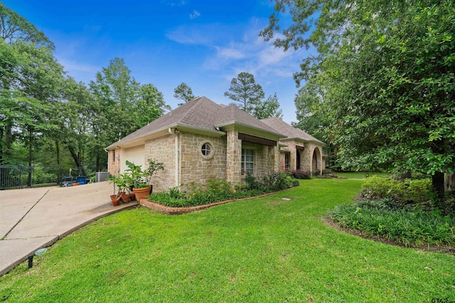 view of front of property with a front lawn and a garage