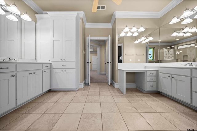 bathroom with walk in shower, vanity, tile patterned floors, and crown molding