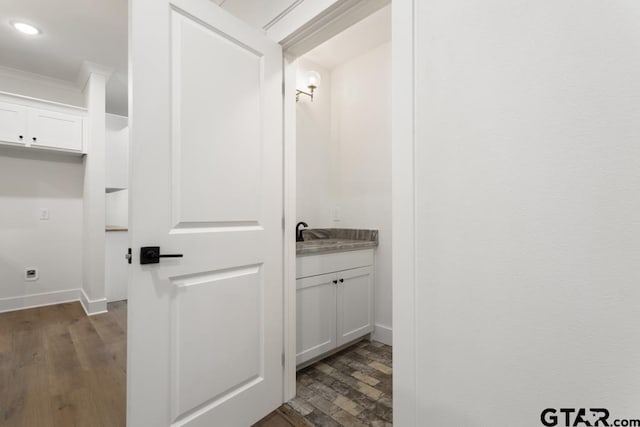 bathroom with wood-type flooring and vanity