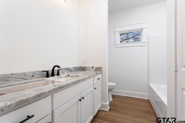 full bathroom with vanity, toilet, hardwood / wood-style floors, and plus walk in shower