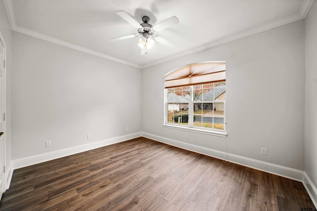 spare room featuring crown molding, dark hardwood / wood-style flooring, and ceiling fan