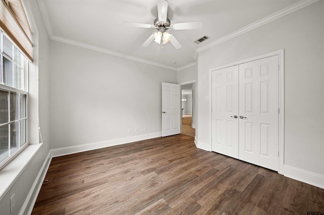 unfurnished bedroom featuring ceiling fan, hardwood / wood-style floors, and crown molding