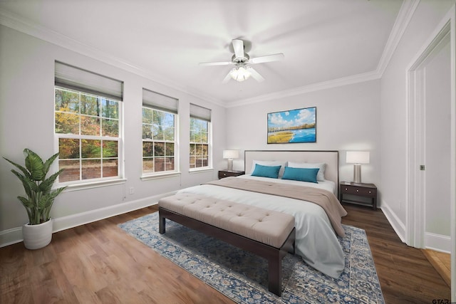 bedroom with dark hardwood / wood-style flooring, ceiling fan, and ornamental molding