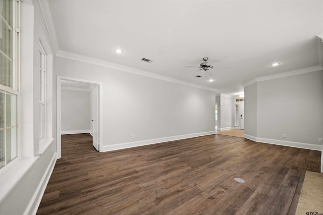 spare room with ornamental molding, ceiling fan, and dark wood-type flooring