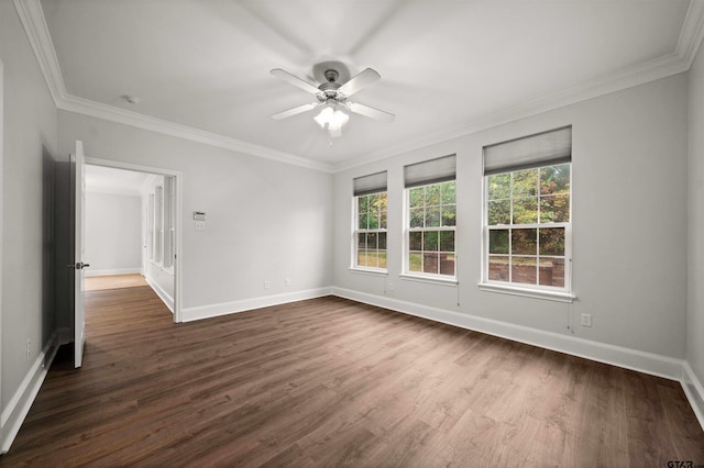 empty room with dark hardwood / wood-style floors, ceiling fan, and crown molding