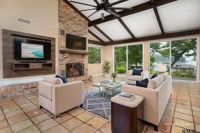 living room featuring beam ceiling, a fireplace, high vaulted ceiling, a ceiling fan, and visible vents