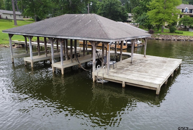 view of dock featuring a water view and boat lift
