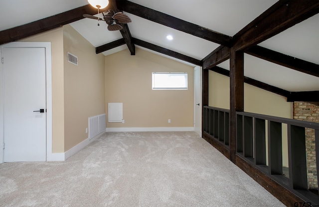 bonus room with lofted ceiling with beams, visible vents, ceiling fan, and baseboards