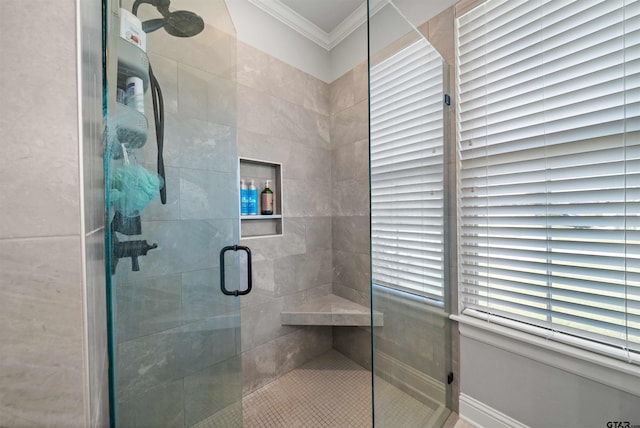 bathroom with walk in shower and ornamental molding