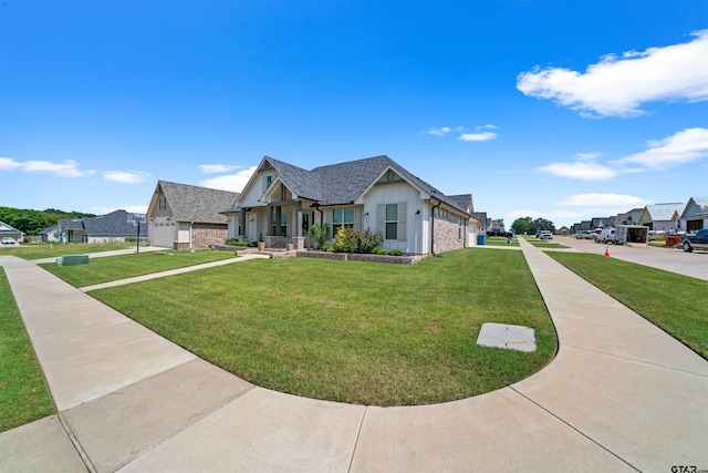 view of front of property featuring a front lawn and a garage