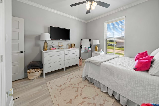 bedroom with ornamental molding, light hardwood / wood-style floors, and ceiling fan