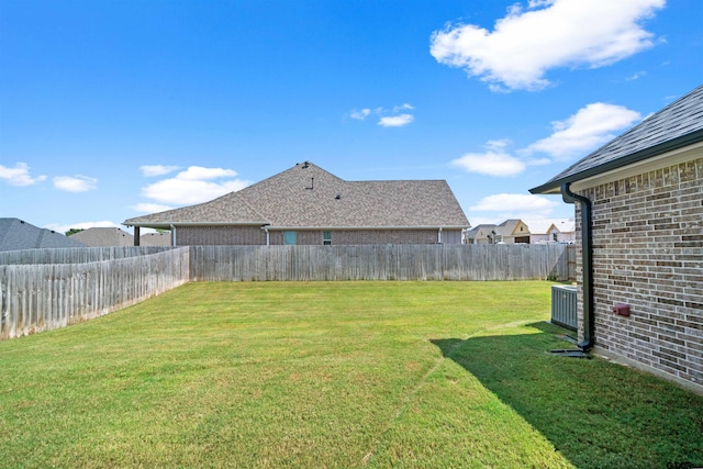 view of yard with central AC