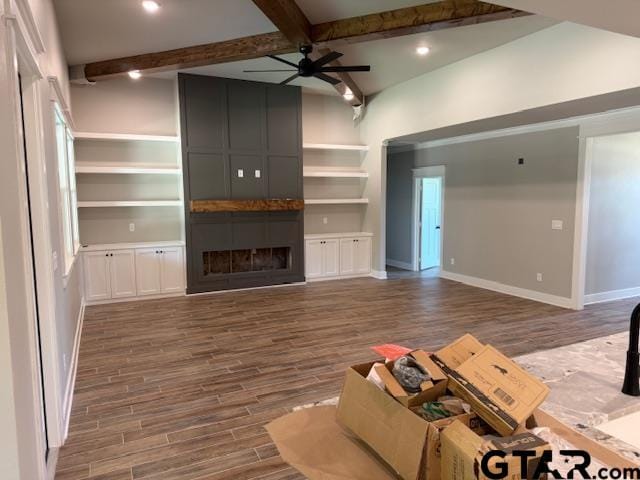 14533 Woodland Creek Dr, Tyler, TX 75706 - unfurnished living room with wood finished floors, beamed ceiling, a ceiling fan, recessed lighting, and a fireplace