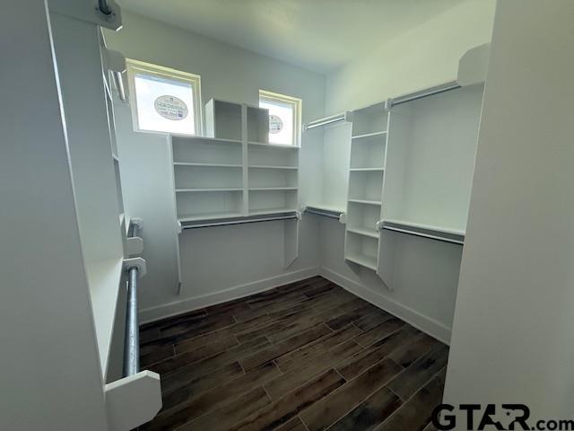 14533 Woodland Creek Dr, Tyler, TX 75706 - walk in closet with dark wood finished floors
