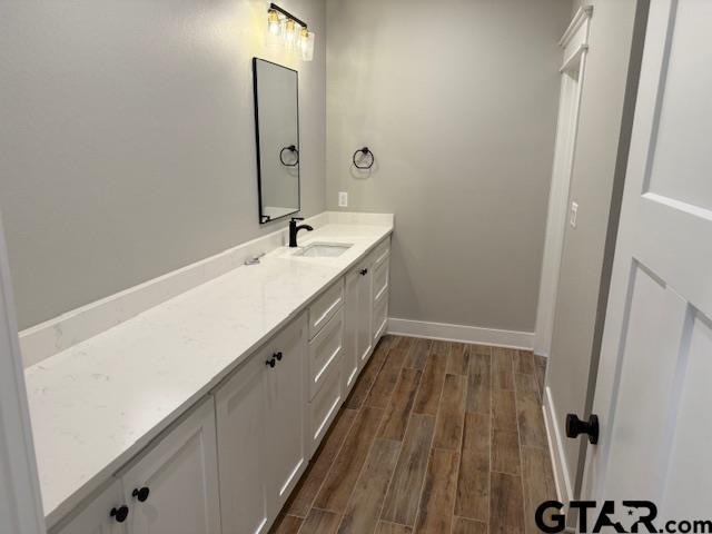 14533 Woodland Creek Dr, Tyler, TX 75706 - bathroom with vanity and wood finished floors