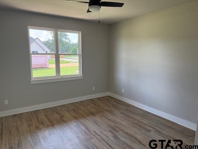 14533 Woodland Creek Dr, Tyler, TX 75706 - empty room featuring a ceiling fan and wood finished floors