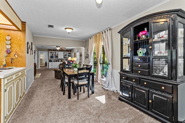 552 W State Highway 7, Crockett, TX 75835 - dining area with light colored carpet, crown molding, ceiling fan, and a textured ceiling
