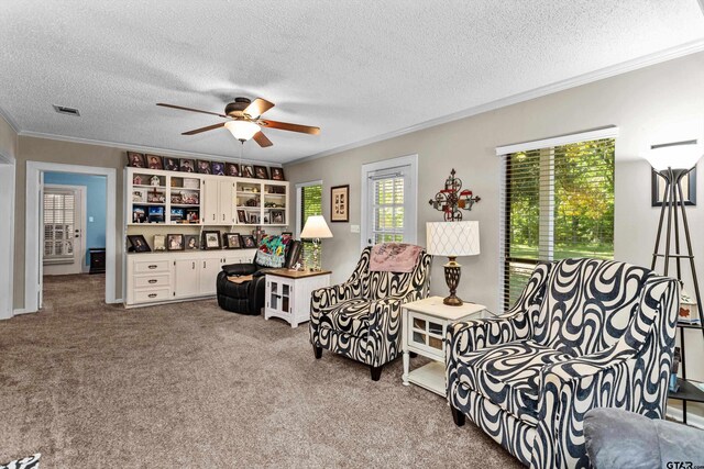 552 W State Highway 7, Crockett, TX 75835 - living room featuring ornamental molding, a textured ceiling, carpet floors, and ceiling fan