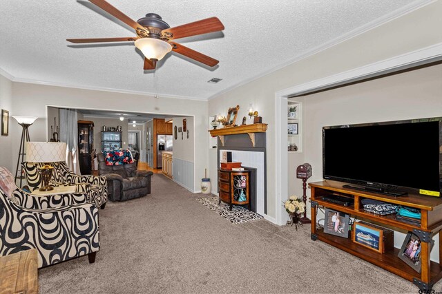 552 W State Highway 7, Crockett, TX 75835 - carpeted living room with a textured ceiling, a ceiling fan, and crown molding