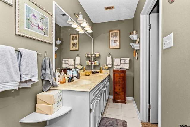 552 W State Highway 7, Crockett, TX 75835 - bathroom featuring vanity, tile patterned flooring, a textured ceiling, and baseboards
