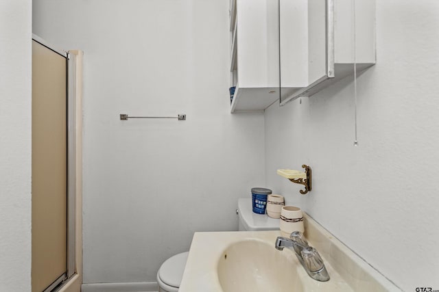 552 W State Highway 7, Crockett, TX 75835 - full bathroom with toilet, a stall shower, and a sink