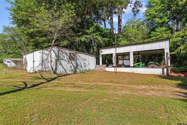 552 W State Highway 7, Crockett, TX 75835 - view of grassy yard with a pole building and an outdoor structure